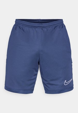 Mørkeblå atletikshorts lavet af letvægtsstof, med elastisk taljebånd og hvidt Nike-logo på det nederste højre ben. Mesh-detaljer ved kanten.