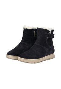 Black suede ankle boots with a plush white fur lining, side zipper, and adjustable strap detail, featuring a light tan sole.
