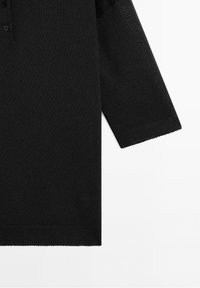 Black long-sleeve knit sweater with buttoned neckline, ribbed cuffs and hem, displayed on a white background.
