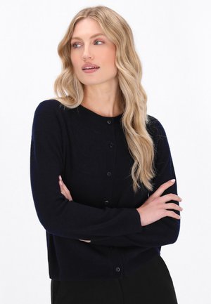 Marineblauer Cardigan mit Knopfverschluss, rundem Ausschnitt, strukturiertem Stoff und langen Ärmeln. Weiches Material mit tailliertem Design.