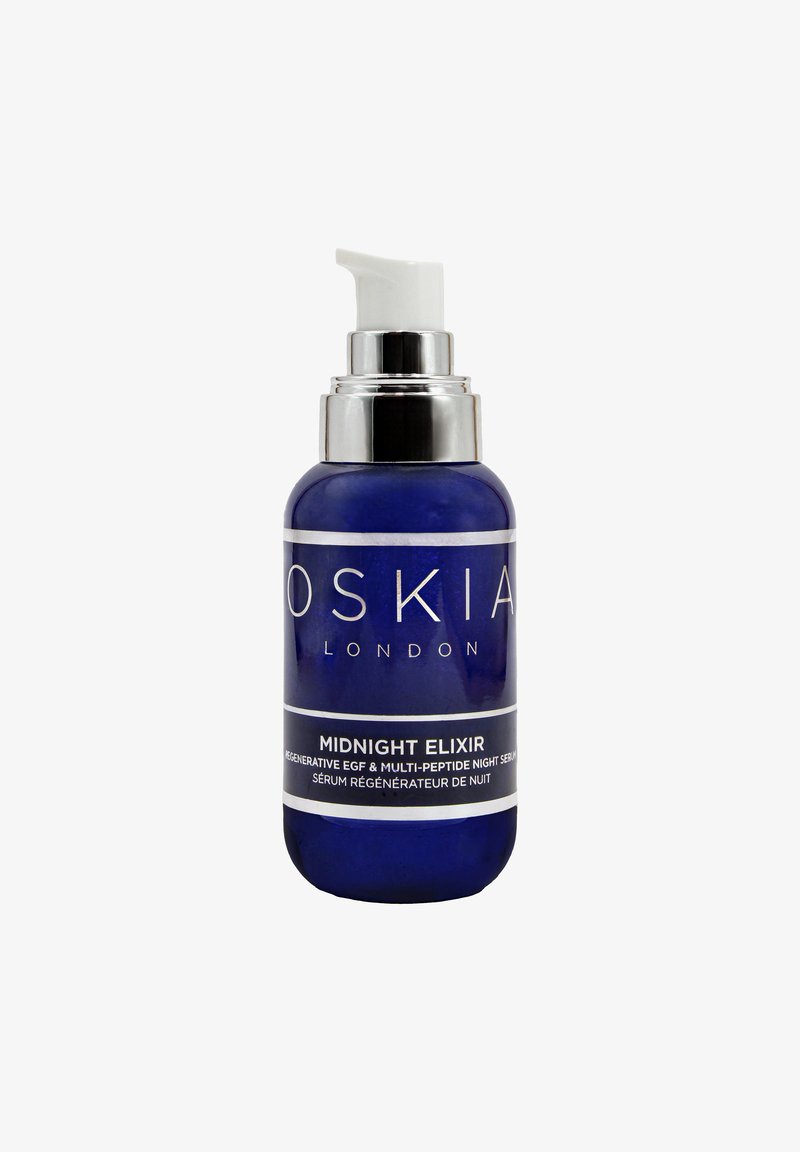 Flacon bleu de sérum de nuit OSKIA London Midnight Elixir avec distributeur blanc et collerette argentée.