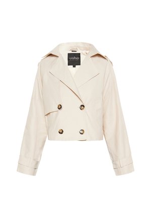 Küpsetatud beez jakk, mis on valmistatud puuvillast, kahe nööbiga esiosaga, suurte nööpidega ja laia krae ning pikkade varrukatega.