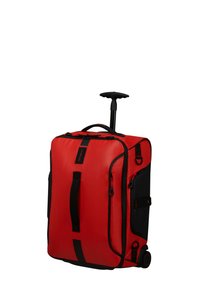 Red wheeled duffel bag with black accents, zippered compartments, sturdy handles, and retractable handle for easy transport. Textured surface.