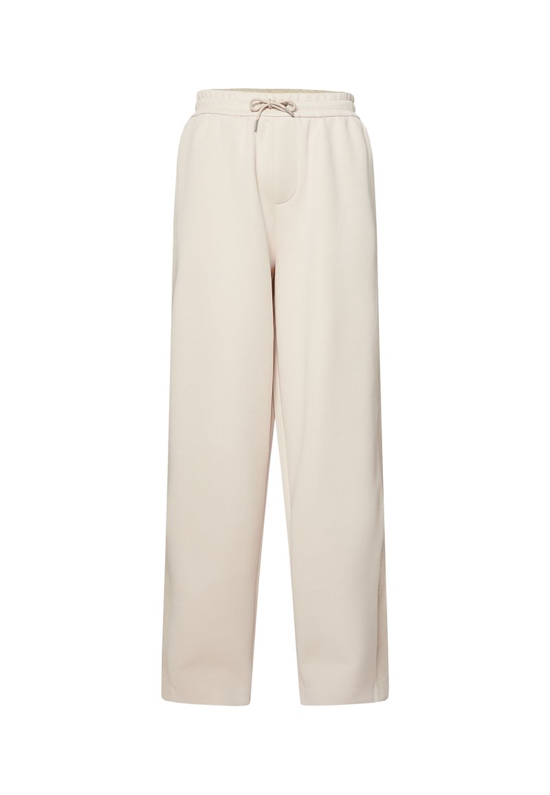 Pantalones beige de tiro alto y pierna ancha con cinturilla elástica y cierre con cordón, hechos de tela suave.