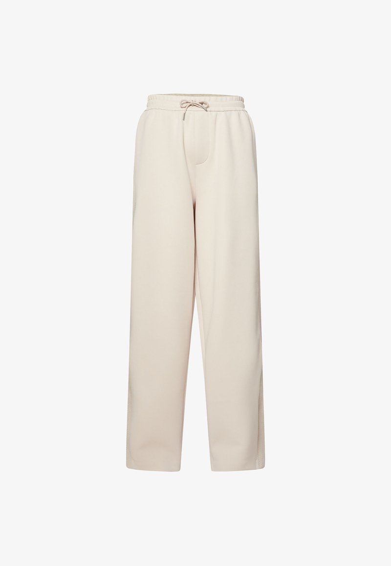 Pantalones beige de tiro alto y pierna ancha con cinturilla elástica y cierre con cordón, hechos de tela suave.