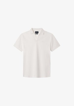 Vaaleanbeige lyhythihainen polo-paita, jossa on V-pääntie, pehmeää puuvillamateriaalia ja pieni logo-tyyli rinnassa.