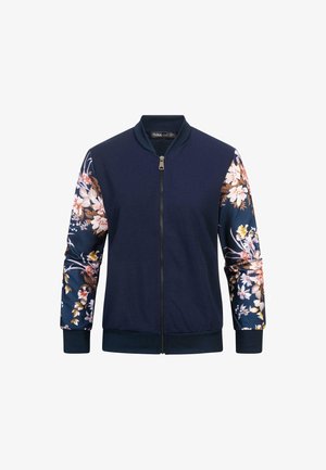 Jūras spēku bomber tipa jaka ar ziedu rakstu piedurknēm. Izgatavota no mīksta auduma, tai ir rāvējslēdzējs un ribots piedurkņu un apakšmala.