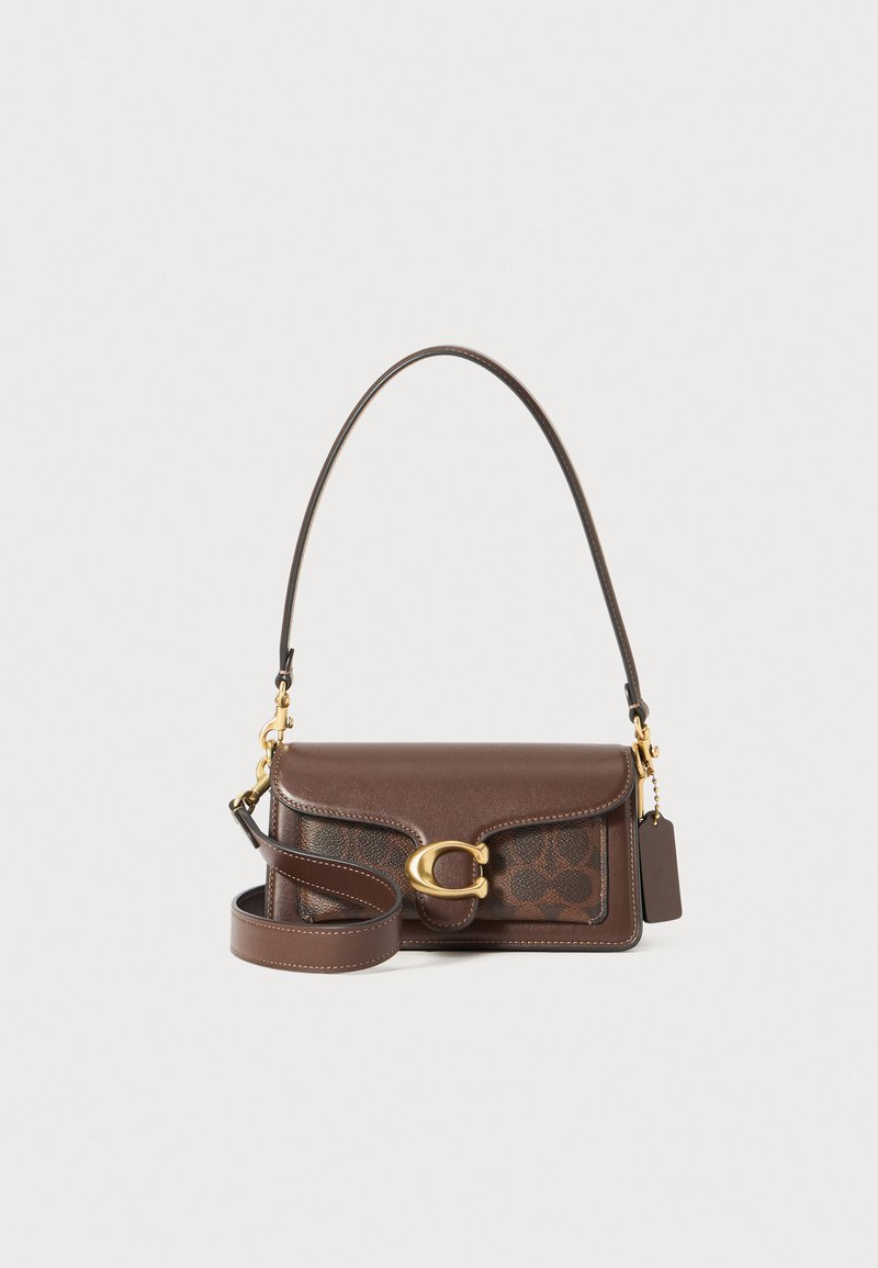 Brown leather handbag with a structured shape, gold hardware, a detachable shoulder strap, and a signature logo pattern.