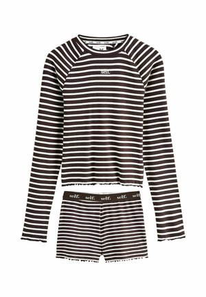 Schwarz-weiß gestreiftes Langarmoberteil und passende Shorts mit dem Aufdruck "self." auf der Brust und am Bund.