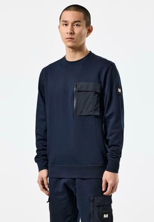 Marine sweatshirt med lange ærmer, rund hals og en lynlåslomme på brystet. Glat stof med en afslappet pasform og ribbede manchetter.