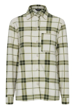 Chemise en flanelle à carreaux verts et blancs avec un devant boutonné, un col et une poche poitrine unique. Texture douce et coupe décontractée.