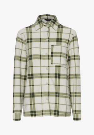 Zeleno-bílá kostkovaná flanelová košile s knoflíkovou přední částí, límcem a jednou náprsní kapsou. Měkká textilie a uvolněný střih.