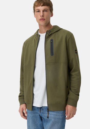 Olive green zip-up hoodie with a drawstring hood, front pockets, and a zippered chest pocket. Features ribbed cuffs and a smooth texture.