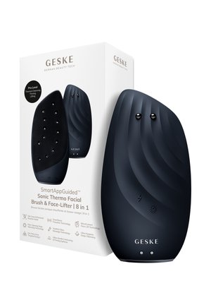 Sort Geske sonisk termo ansigtsbørste og ansigtsløfterenhed med teksturerede og glatte sider, vist sammen med sin hvide produktindpakning.