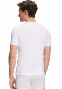 White short-sleeve t-shirt made of smooth fabric, featuring a crew neckline and a fitted design. Plain back view with no patterns or graphics.