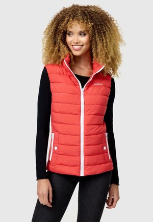 Red puffer vest with a standing collar, quilted texture, white zipper, and snap-button pockets, worn over a black long-sleeve top.
