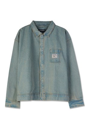 Light blue denim jacket with a pointed collar, long sleeves, chest pocket, and visible stitching; relaxed fit and worn texture.