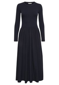 Diepblauwe jurk met een getailleerd geribd lijfje met lange mouwen, overgaand in een vloeiende, geplooide rok. Overal een gladde textuur.