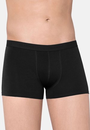 Schwarze Boxer-Briefs aus weichem Stoff, mit eng anliegendem Schnitt, elastischem Bund und kontrastierenden Nähten entlang der Nähte.