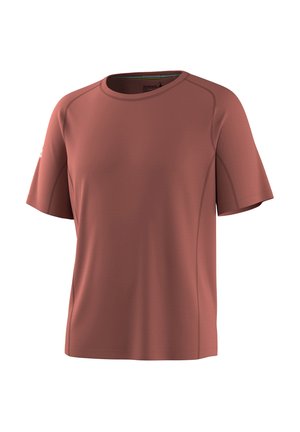 Lyhythihainen urheilupaita pyöreällä pääntiellä, hailakan ruosteenvärinen, näkyvillä saumoilla ja pienellä logolla vasemmassa hihassa.