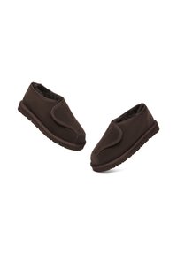 Brown fabric slippers with a soft, fuzzy interior lining, rounded toe, and a low profile. The sole is textured for grip.