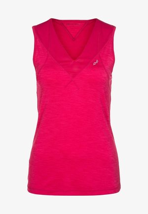 Kobieta w jasnoróżowym bezrękawniku z dekoltem w serek, czarnych dopasowanych legginsach z logo i odblaskowymi detalami oraz czarnych butach sportowych.