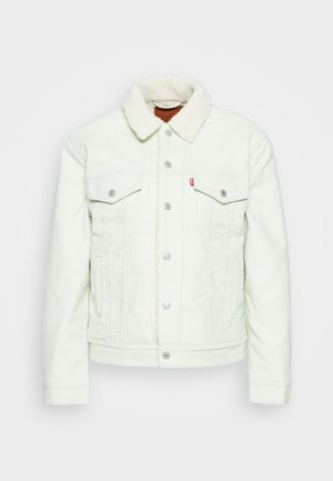 Veste en denim vert clair avec col en fausse fourrure, deux poches poitrine, fermeture à bouton et quincaillerie argentée. Design texturé et décontracté.