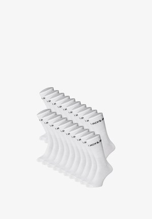 Calze di cotone bianche disposte in fila, con bordi rigati e testo nero che legge "JACK & JONES" sul lato.