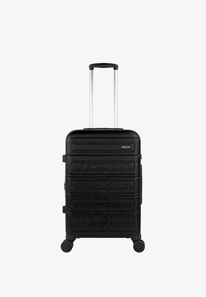 Maleta rígida negra con cuatro ruedas y un asa telescópica plateada extendida, marca "Jaslen" visible en el frente.