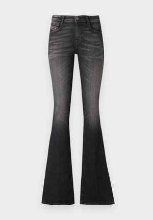Black flared jeans with a faded wash, five-pocket design, and metallic button closure. Fabric shows a slight stretch for comfort.