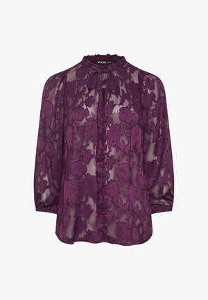 Camicia trasparente viola con ricamo floreale, collo alto e chiusura con bottoni. Maniche lunghe con polsini arricciati e vestibilità rilassata.
