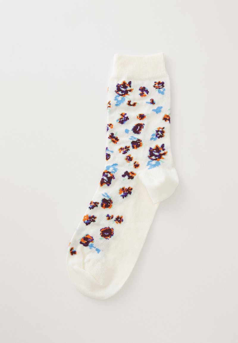 Calcetín de algodón tipo crew en blanco con un patrón floral, que presenta acentos en naranja, púrpura y azul. Parte superior ribeteada y área del dedo reforzada.