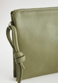 Next Taška cez plece - sage green