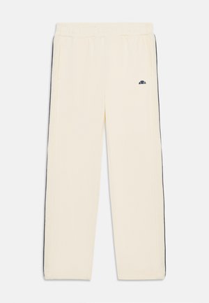 Calças de moletom de cor creme com riscas laterais pretas, cintura elástica, pernas direitas e um pequeno logo no lado esquerdo. Tecido suave.