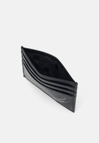 Black bi-fold wallet featuring a textured exterior, several card slots, and a smooth interior lining with a subtle pattern.