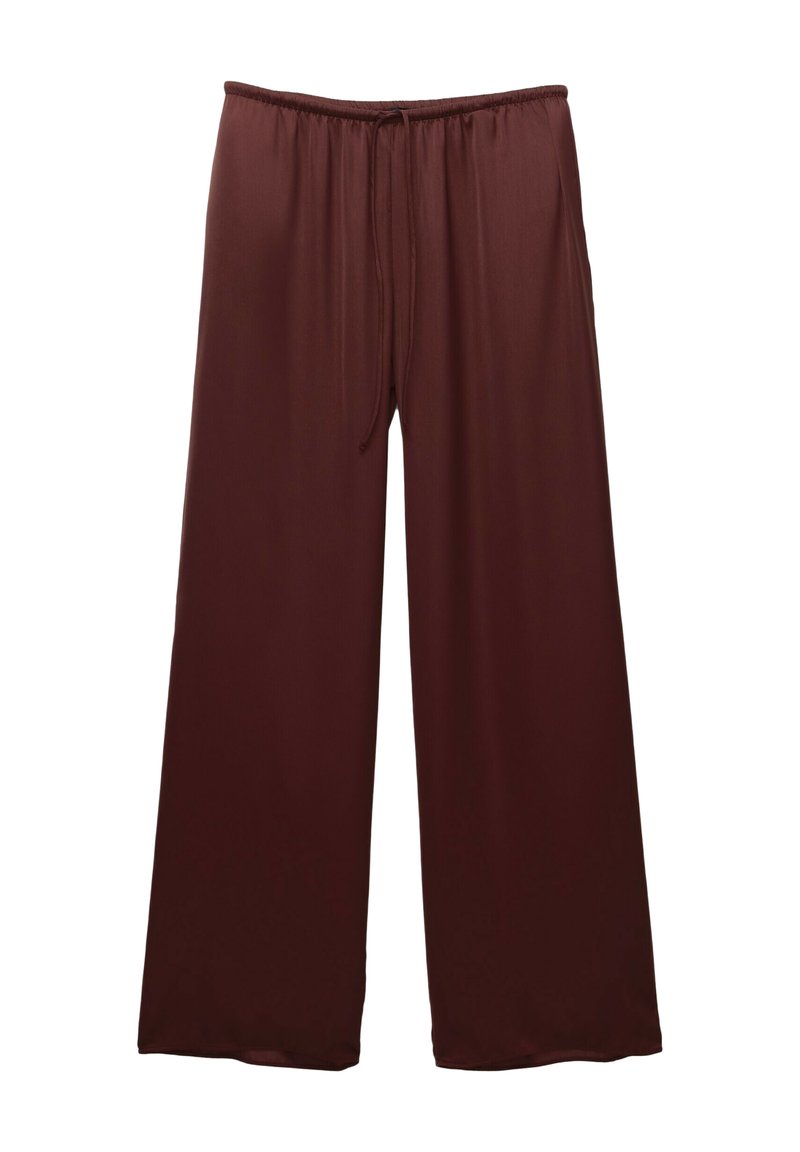 Leve trousers in a dark brown color made from smooth material. Features an elastic waistband with a drawstring for an adjustable fit.
