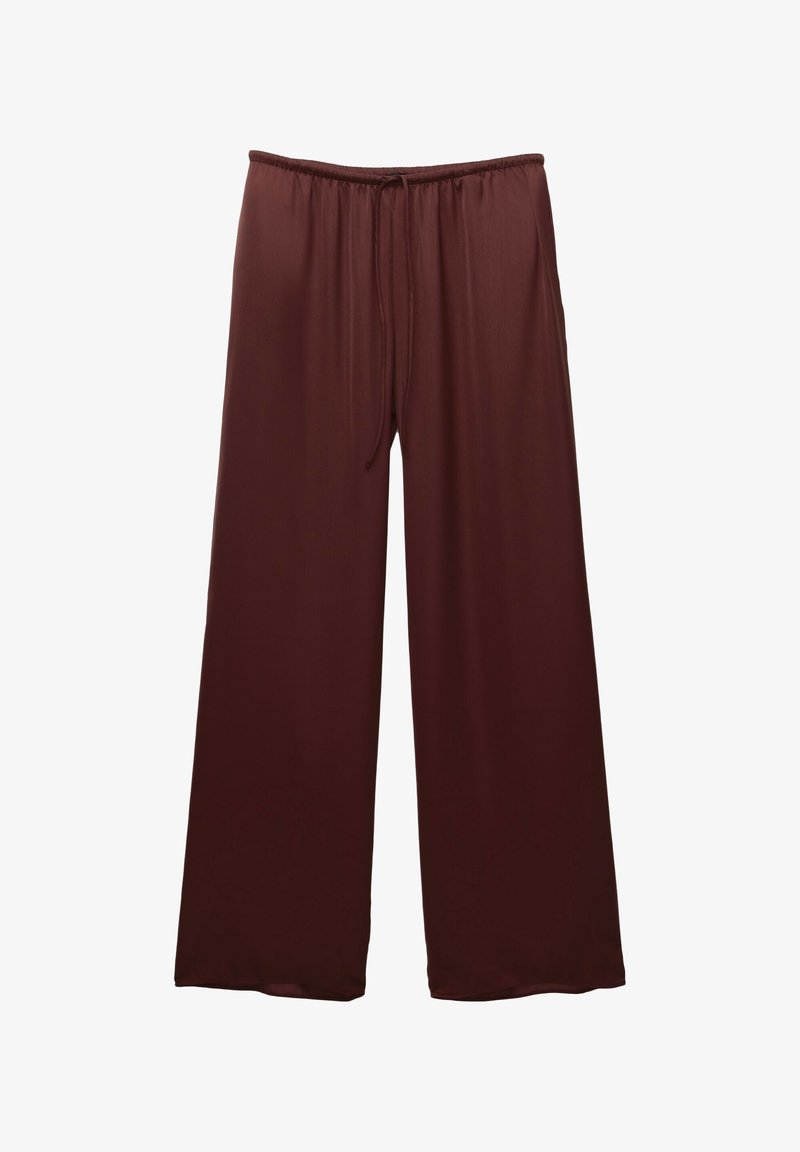 Leve trousers in a dark brown color made from smooth material. Features an elastic waistband with a drawstring for an adjustable fit.
