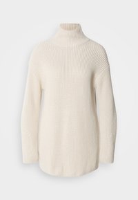 Crème-kleurige gebreide trui met een hoge col, brede mouwen en textuurpatronen op de mouwen en het lijf.