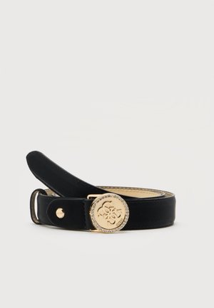 Ceinture en cuir noir avec une boucle ronde dorée ornée d’un logo décoratif et d’une bordure de strass, présentée enroulée sur un fond neutre.