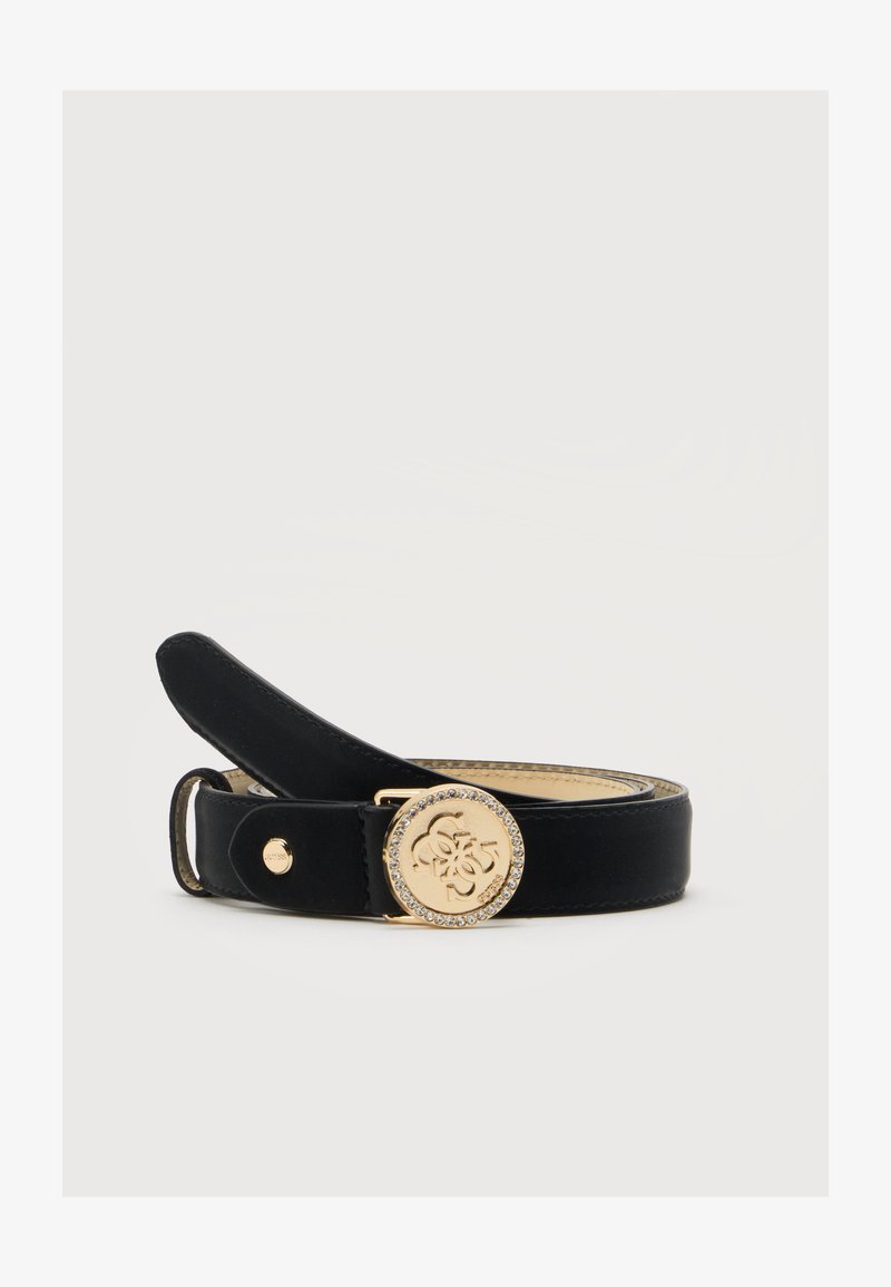 Ceinture en cuir noir avec une boucle ronde dorée ornée d’un logo décoratif et d’une bordure de strass, présentée enroulée sur un fond neutre.