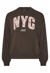 Felpa marrone con maniche lunghe, caratterizzata dalla scritta "NYC" in design a quadri rosa e "1975" in bianco sottostante. Polsini e scollatura a costine.