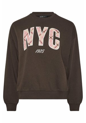 Brązowa bluza z długim rękawem z napisem "NYC" w różowej kratkę oraz "1975" na białym tle poniżej. Prążkowane mankiety i dekolt.