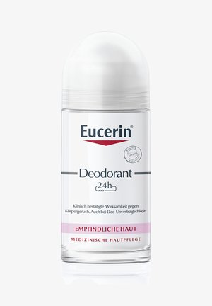 Eucerin 24h deodorant in a transparent cylindrical bottle with a white dome cap. Label features blue and pink text, indicating sensitive skin suitability.