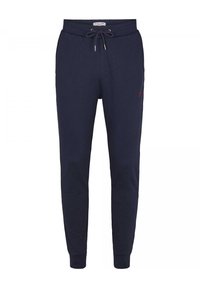 Marina blöjor tillverkade av mjukt tyg, med elastisk midja med dragsko, smalnande ben och en liten logotyp på övre låret.