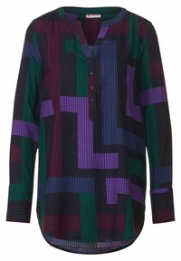 Långärmad skjorta med V-ringning, med ett geometriskt mönster i nyanser av lila, grönt och blått på en mörk bakgrund. Detalj med knapplist.