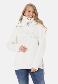 White hooded sweatshirt with a high collar, featuring embroidered text "Legendary" and two black toggle closures at the neck.