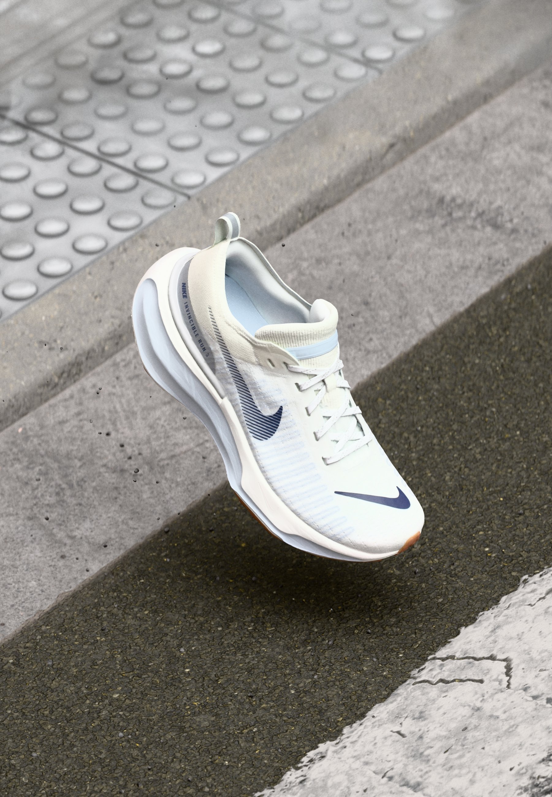 Nike ZoomX Invincible 3 Running Shoes - Cream Upper with Blue Swoosh Cut in half: Nike Invincible 3 Review | RunRepeat main image 2