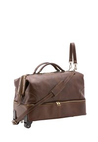 Borsa da viaggio in pelle marrone con manici arrotolati, tracolla regolabile, due cerniere, hardware di tonalità dorata e superficie liscia.