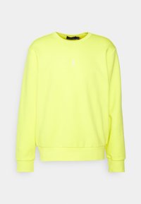 Živě žlutá mikina vyrobená z bavlny, s kulatým výstřihem, dlouhými rukávy a malým bílým logem na hrudi.