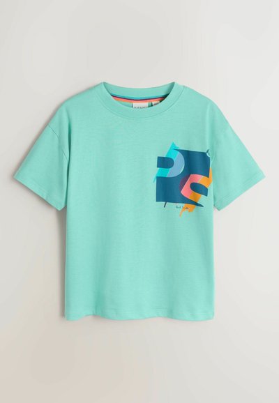 T-shirt à manches courtes vert menthe en coton, avec un motif graphique multicolore sur le devant composé de formes abstraites et d'accents.